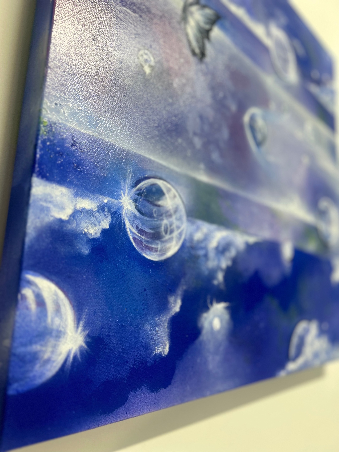Bubbles across canvas, side view